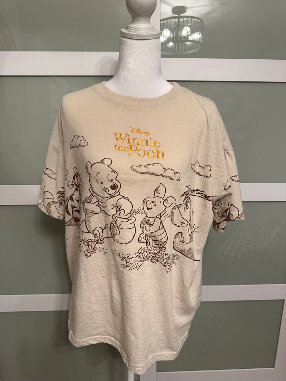 Disney Winnie the Pooh Beige Tee with Brown Line Art and Yellow Logo
